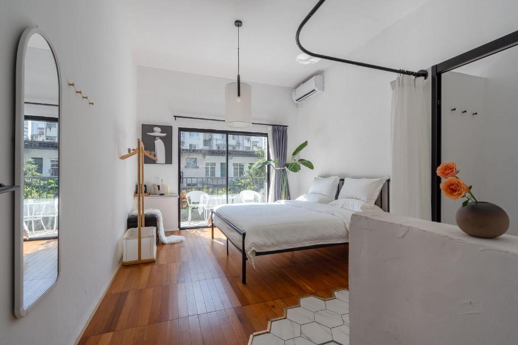 Postel nebo postele na pokoji v ubytování Su Jiu Apartment