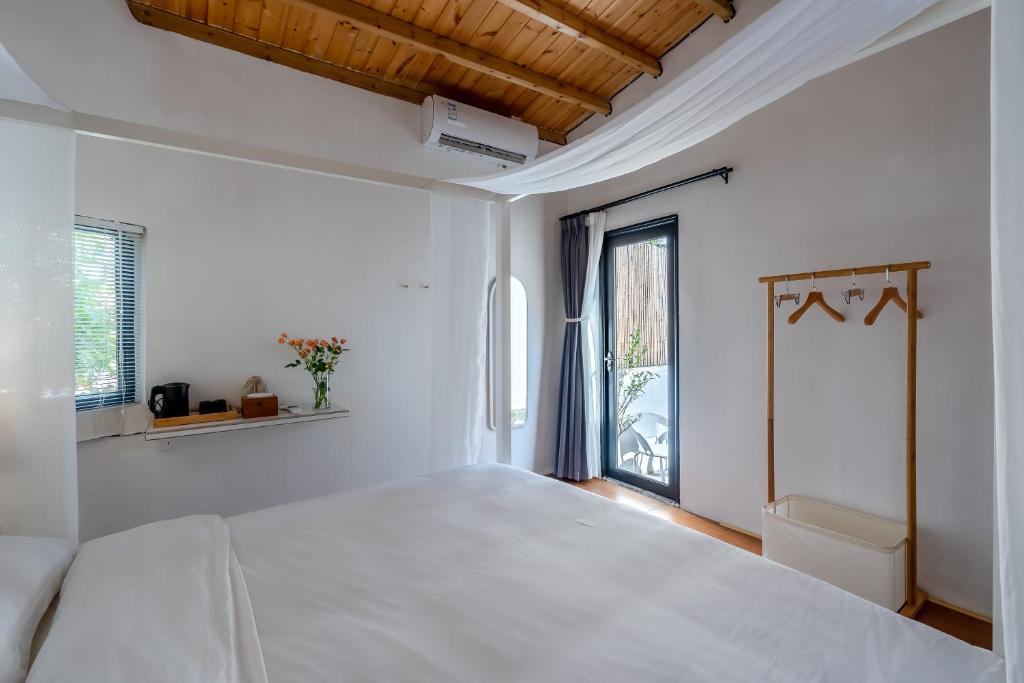 Postel nebo postele na pokoji v ubytování Su Jiu Apartment