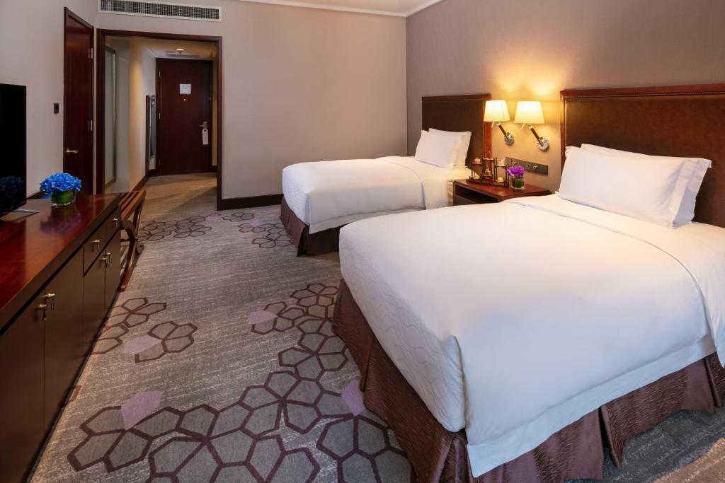 Postel nebo postele na pokoji v ubytování Jin Jiang International Hotel Xi'an