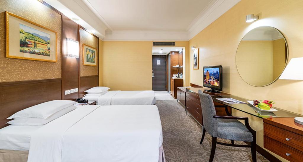 Postel nebo postele na pokoji v ubytování Millennium Harbourview Hotel Xiamen-Near Metro Station & Zhongshan Road
