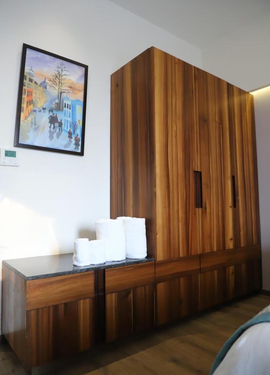 Postel nebo postele na pokoji v ubytování Geeta Sarovar Portico, Panipat