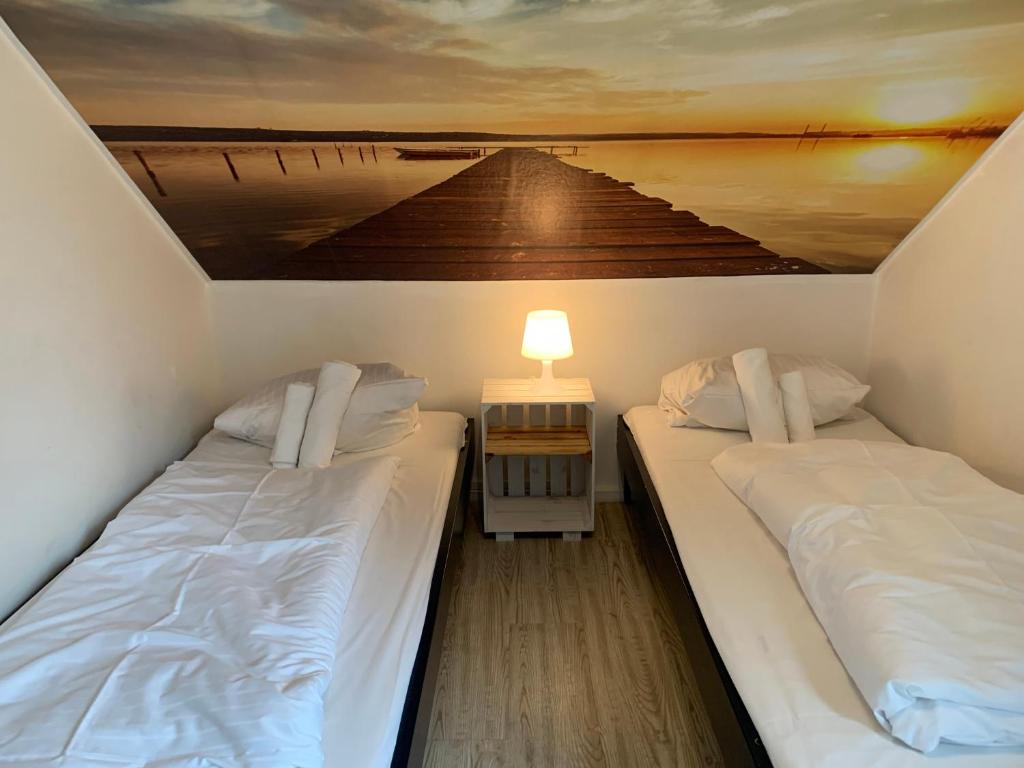 Postel nebo postele na pokoji v ubytování My Brand Boardinghouse Hamburg Volksdorf