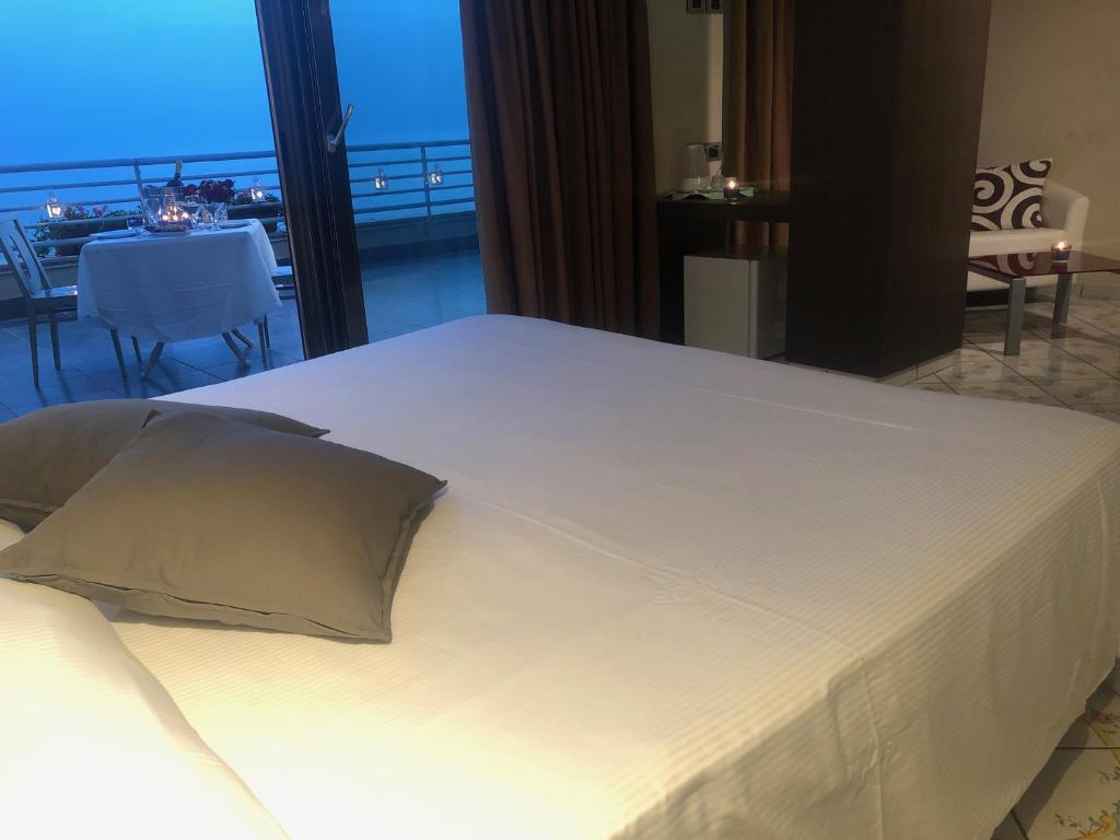 Postel nebo postele na pokoji v ubytování Hotel Ancora