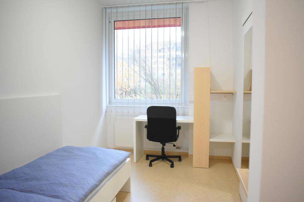 Postel nebo postele na pokoji v ubytování SOVEA Hotel - City