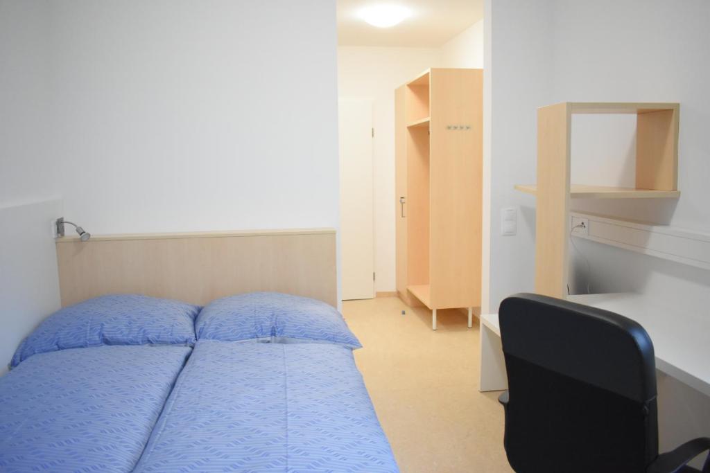Postel nebo postele na pokoji v ubytování SOVEA Hotel - City