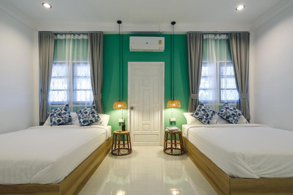 Postel nebo postele na pokoji v ubytování Yindee Home & Cafe