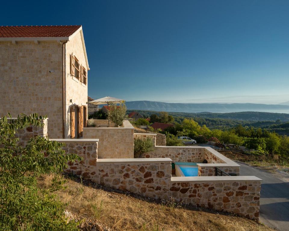a stone house with a view at Design Villa Mar Hvar Island in Pitve