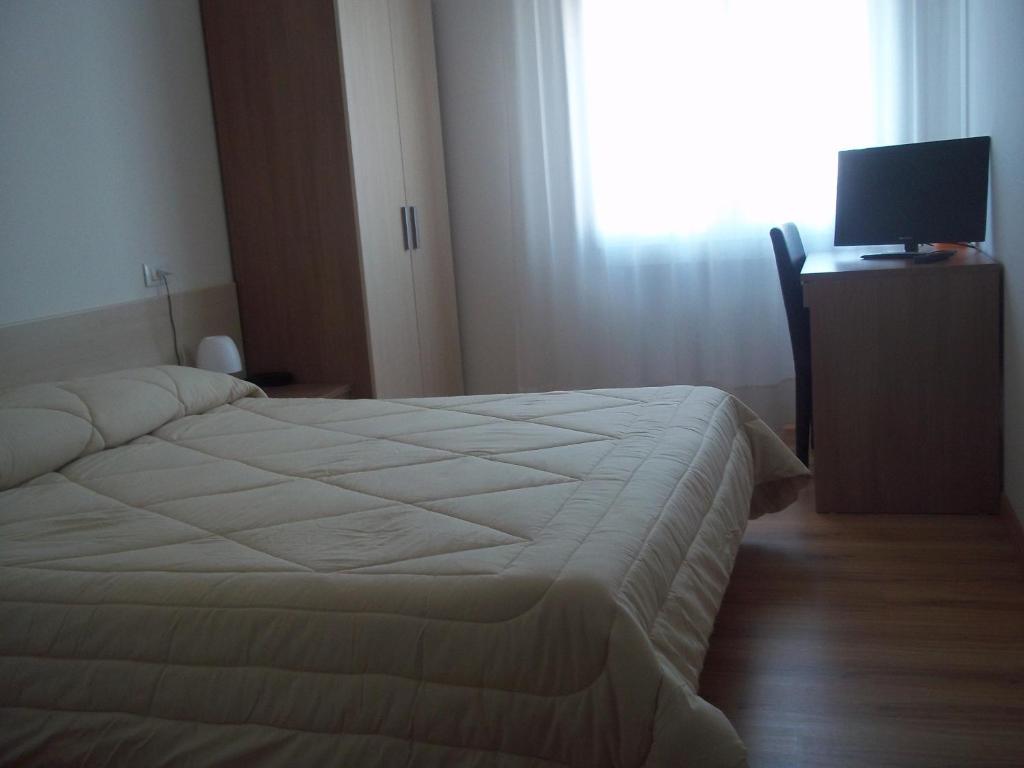 Postel nebo postele na pokoji v ubytování Hotel Gronda Lagunare
