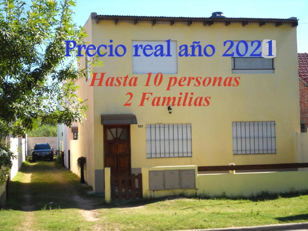 a building with a sign on the side of it at Las golondrinas in San Clemente del Tuyú