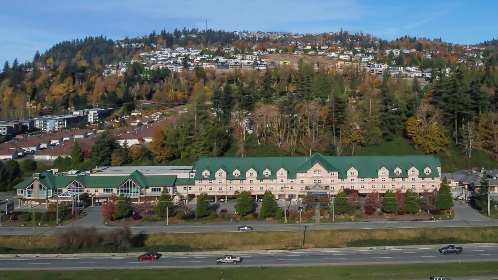an aerial view of a large building with a green roof at Clarion Hotel & Conference Centre in Abbotsford