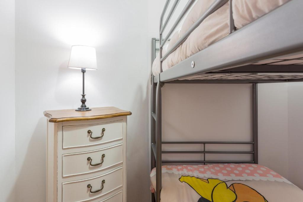 Łóżko lub łóżka w pokoju w obiekcie Apartamentos Sierra Nevada Prime Bluettravel