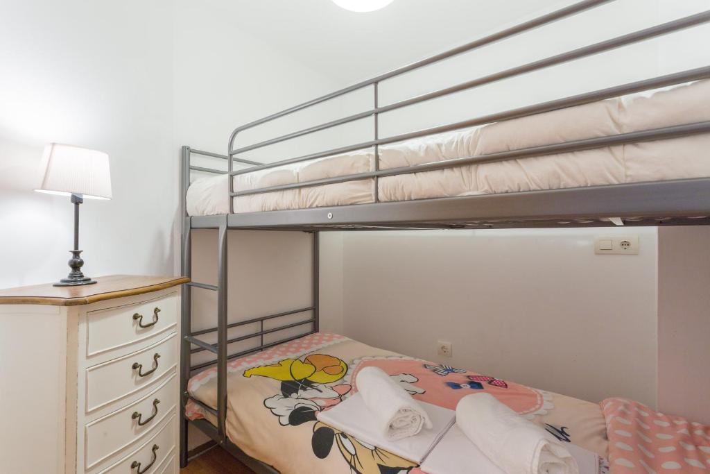 Łóżko lub łóżka w pokoju w obiekcie Apartamentos Sierra Nevada Prime Bluettravel
