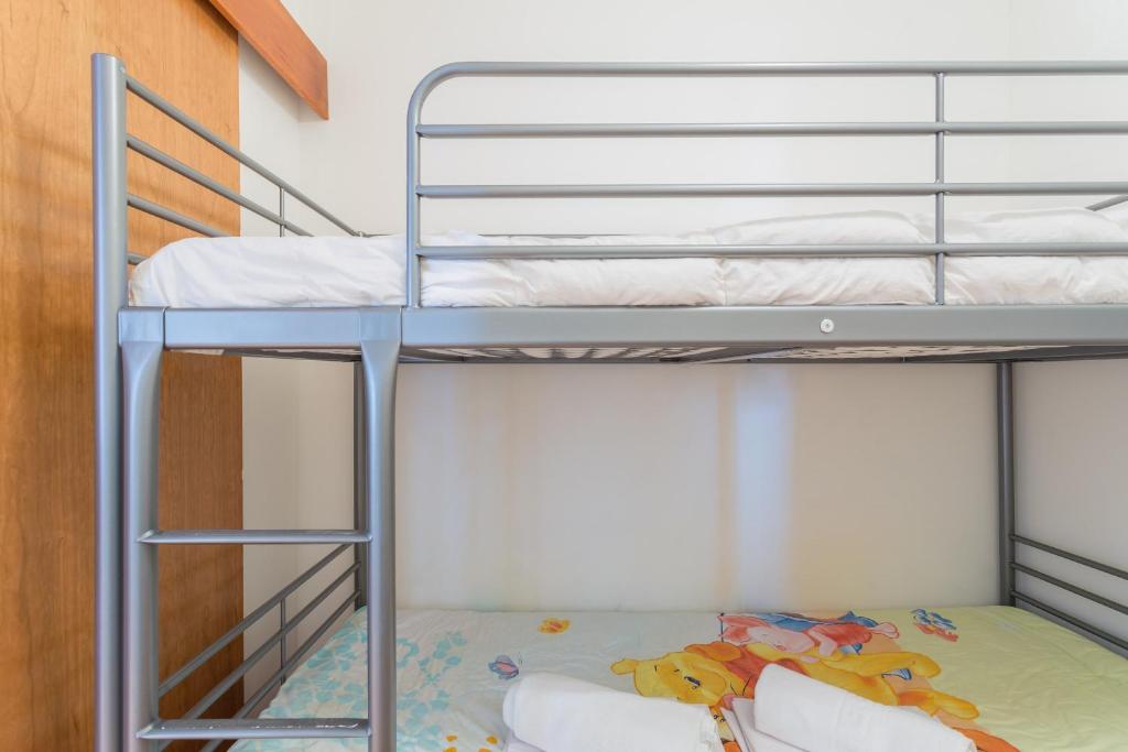 Łóżko lub łóżka w pokoju w obiekcie Apartamentos Sierra Nevada Prime Bluettravel