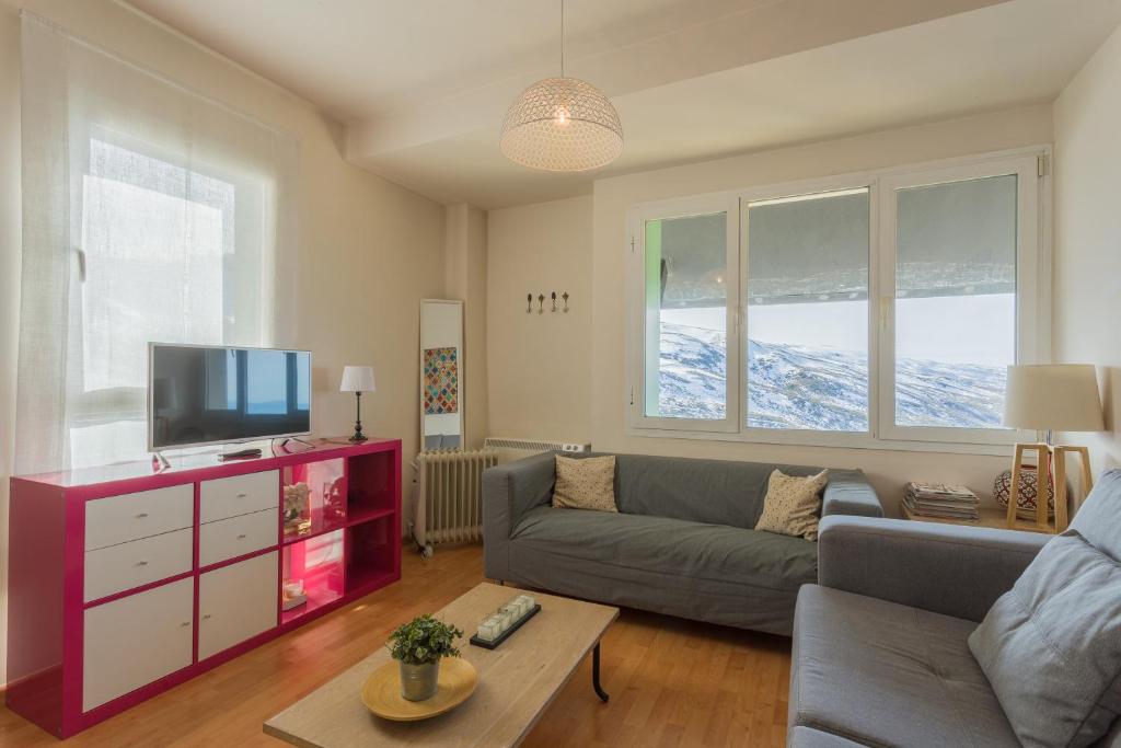 Telewizja i/lub zestaw kina domowego w obiekcie Apartamentos Sierra Nevada Prime Bluettravel