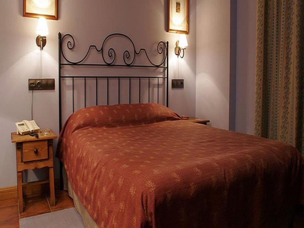 Postel nebo postele na pokoji v ubytování Hotel Casbas