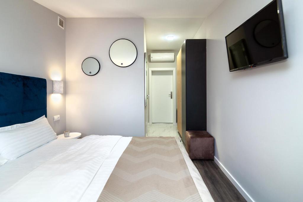 Postel nebo postele na pokoji v ubytování AUSTRIAN APART HOTEL