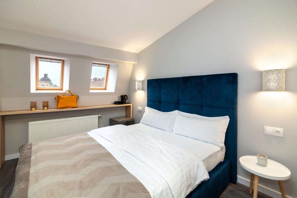 Postel nebo postele na pokoji v ubytování AUSTRIAN APART HOTEL