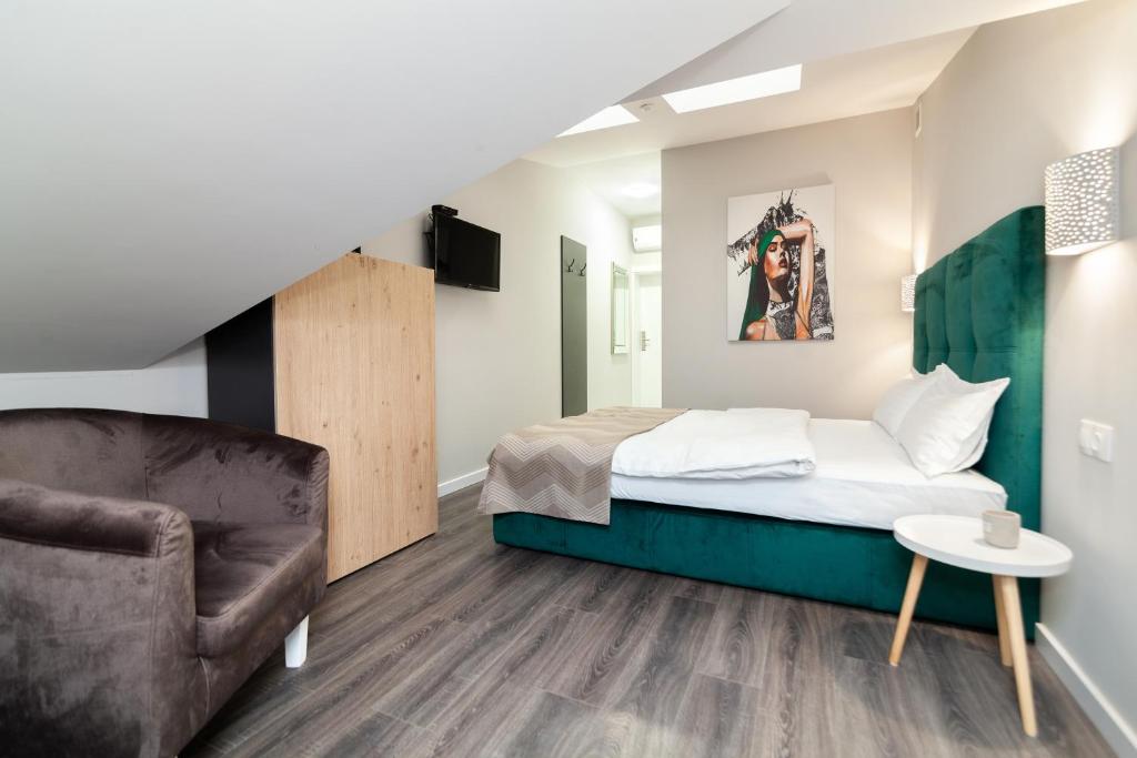Postel nebo postele na pokoji v ubytování AUSTRIAN APART HOTEL