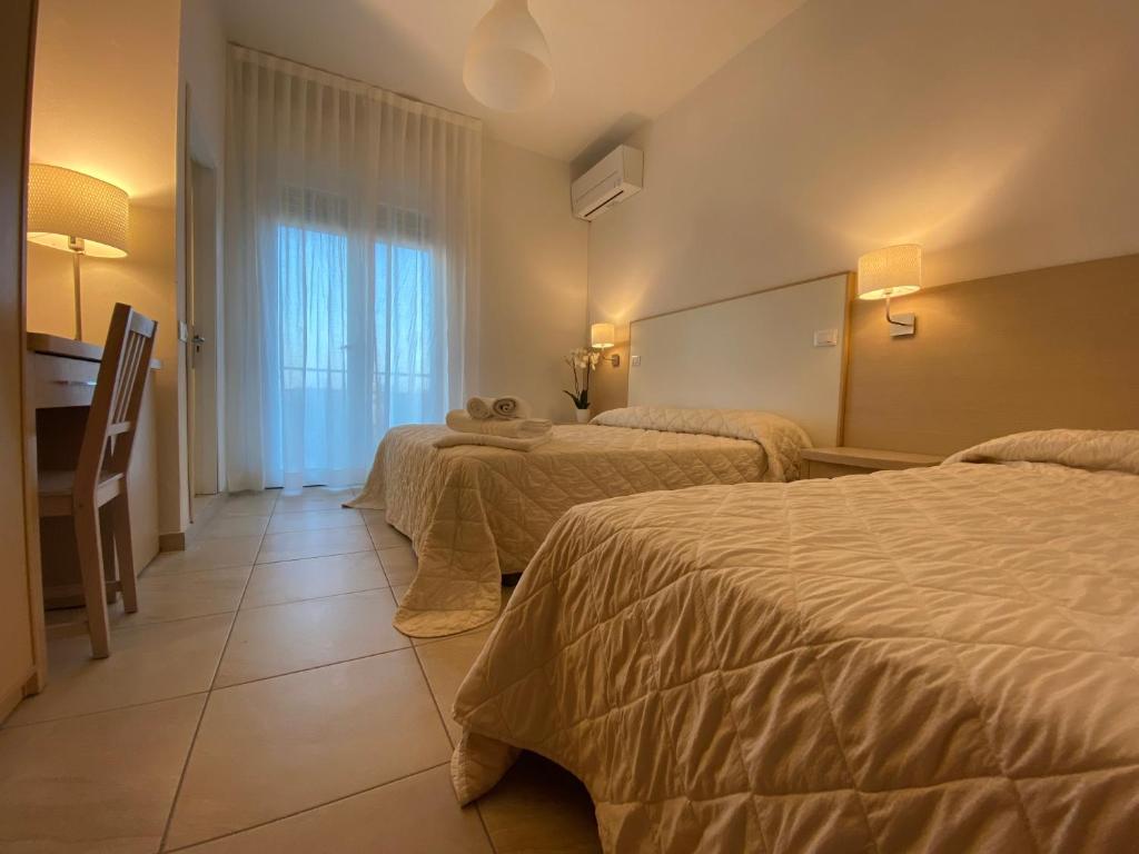 Postel nebo postele na pokoji v ubytování Hotel Palladio B&B