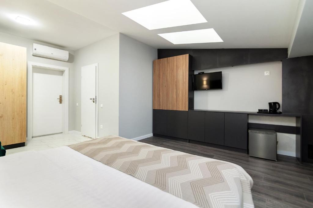 Postel nebo postele na pokoji v ubytování AUSTRIAN APART HOTEL