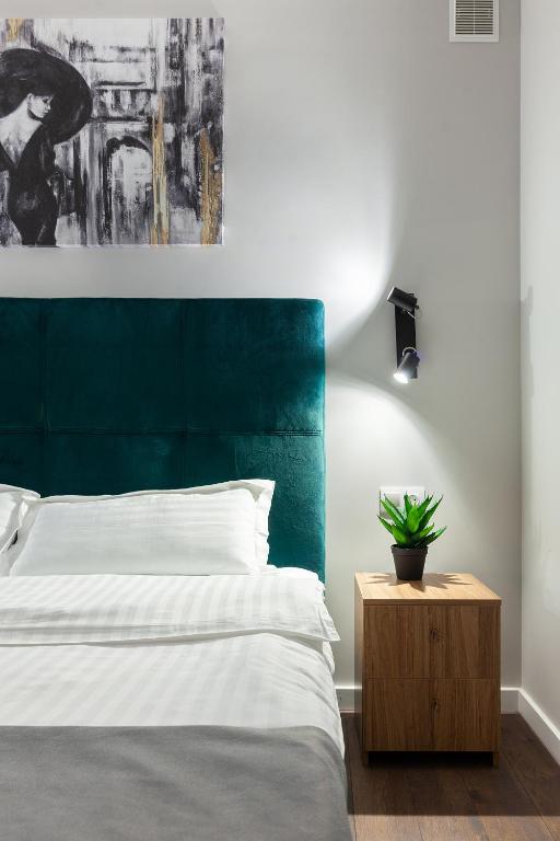 Postel nebo postele na pokoji v ubytování AUSTRIAN APART HOTEL