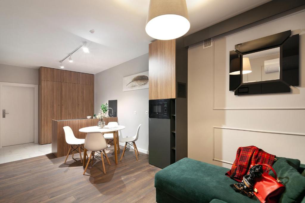 TV a/nebo společenská místnost v ubytování AUSTRIAN APART HOTEL