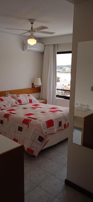 Postel nebo postele na pokoji v ubytování Hotel Ricadi