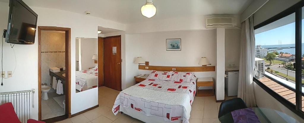 Postel nebo postele na pokoji v ubytování Hotel Ricadi