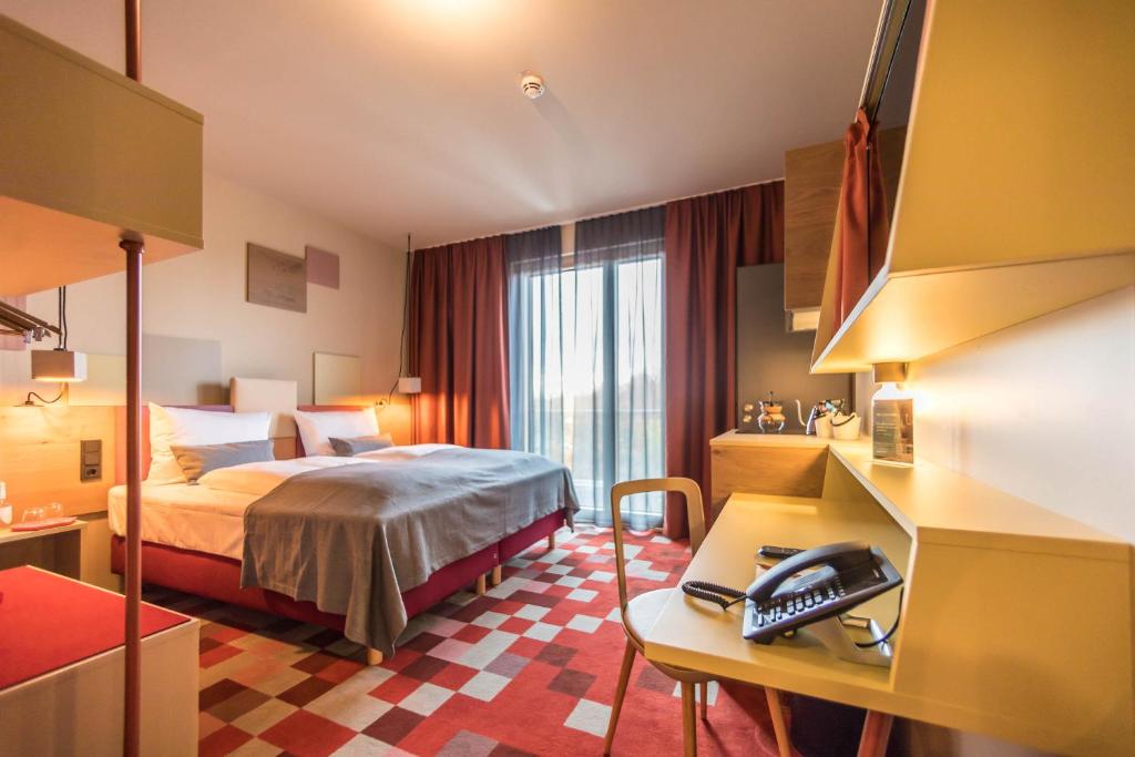 Postel nebo postele na pokoji v ubytování Hotel einsmehr