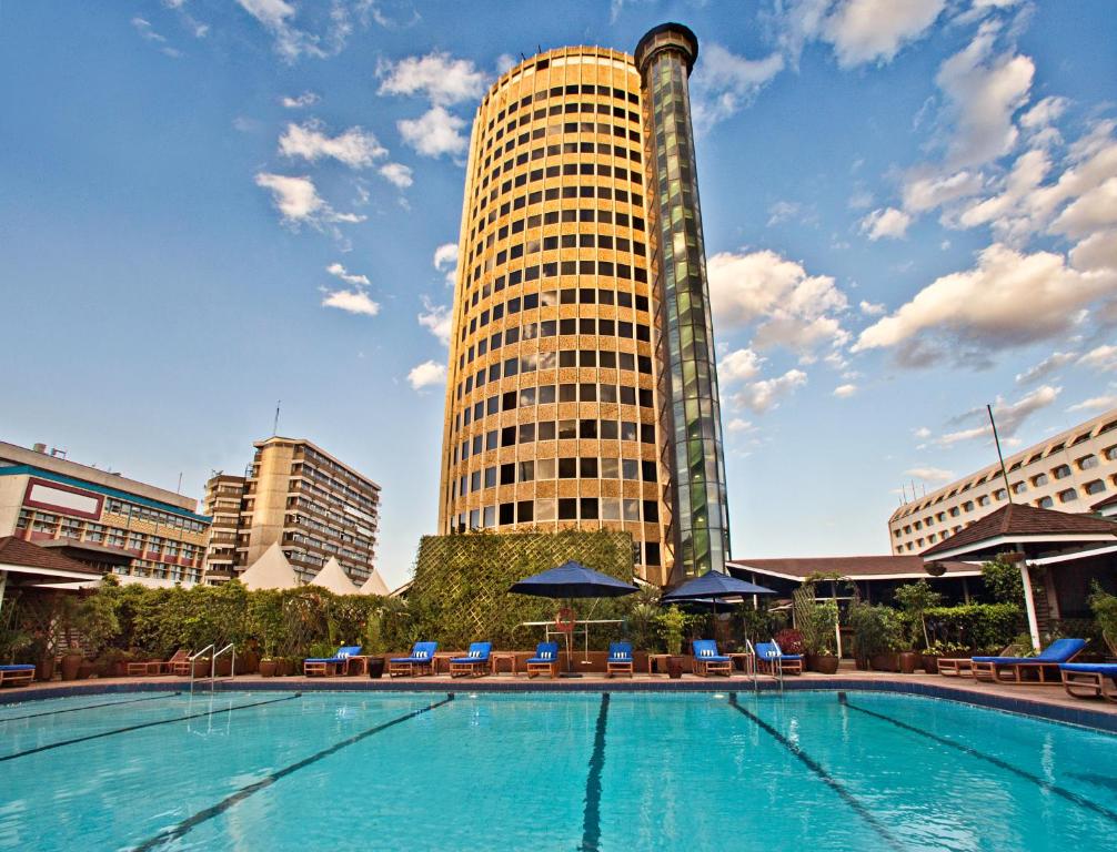 a large swimming pool in the middle of a city at Hilton Nairobi in Nairobi