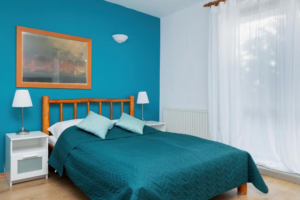 Posteľ alebo postele v izbe v ubytovaní OLECKI Holiday House