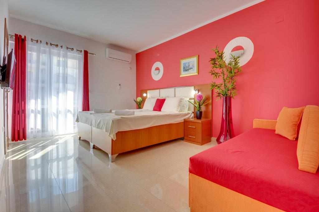 Postel nebo postele na pokoji v ubytování Aparthotel Villa Primafila