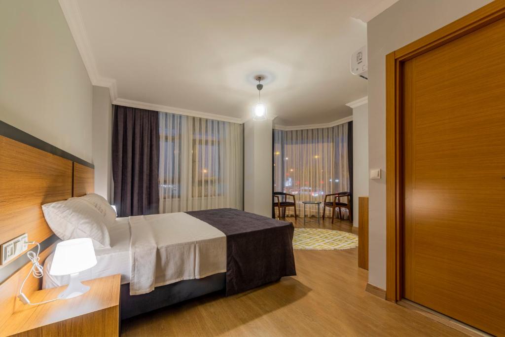 Voodi või voodid majutusasutuse Antalya Business Hotel toas