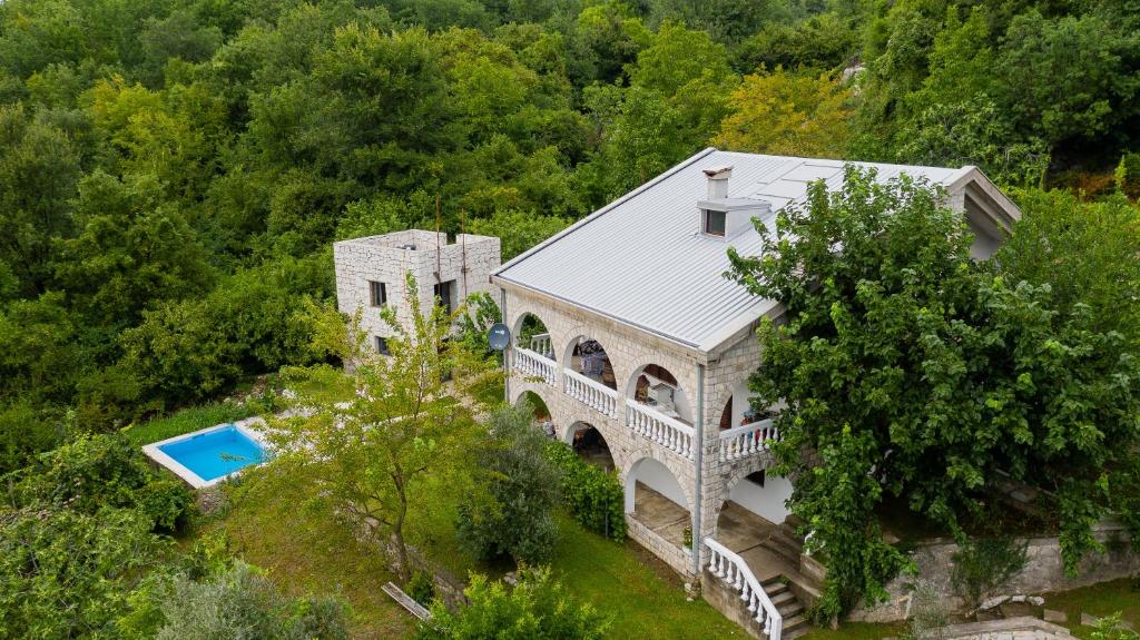 an aerial view of a house with a swimming pool at Village house Vrelo in Mandići