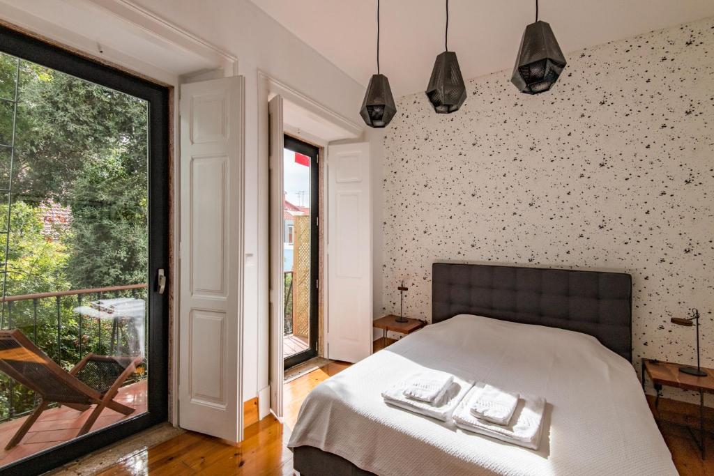 
Uma cama ou camas num quarto em Lost Lisbon :: Avenida House
