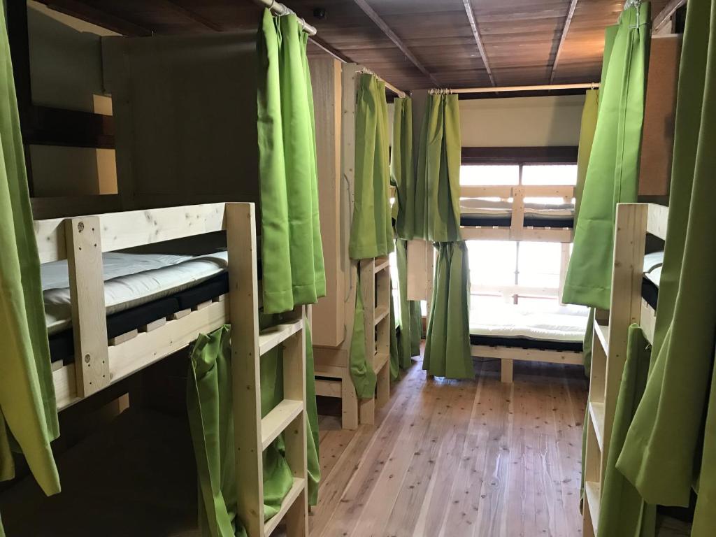 Postel nebo postele na pokoji v ubytování Guesthouse Matsushiro Walkers