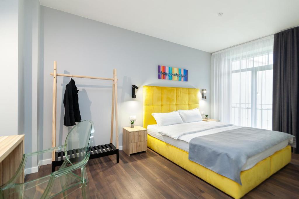 Postel nebo postele na pokoji v ubytování AUSTRIAN APART HOTEL