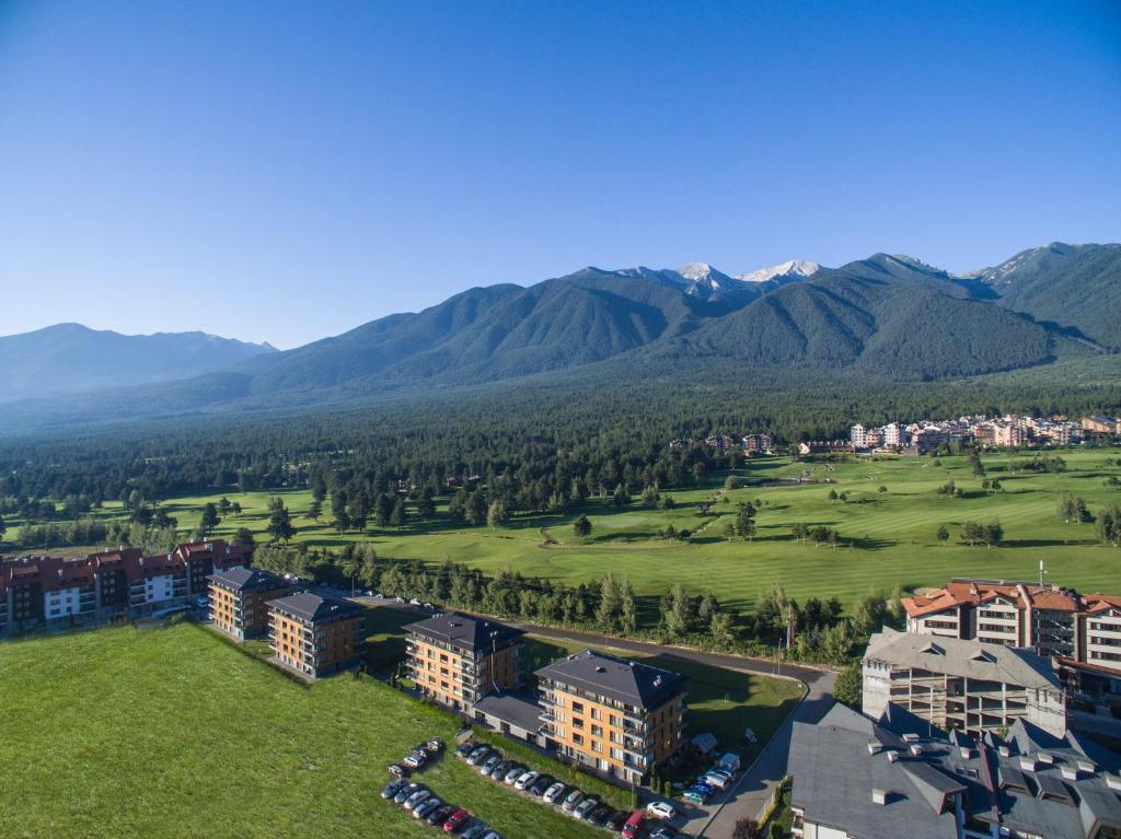 an aerial view of a resort with mountains in the background at Cornelia Deluxe Residence in Bansko