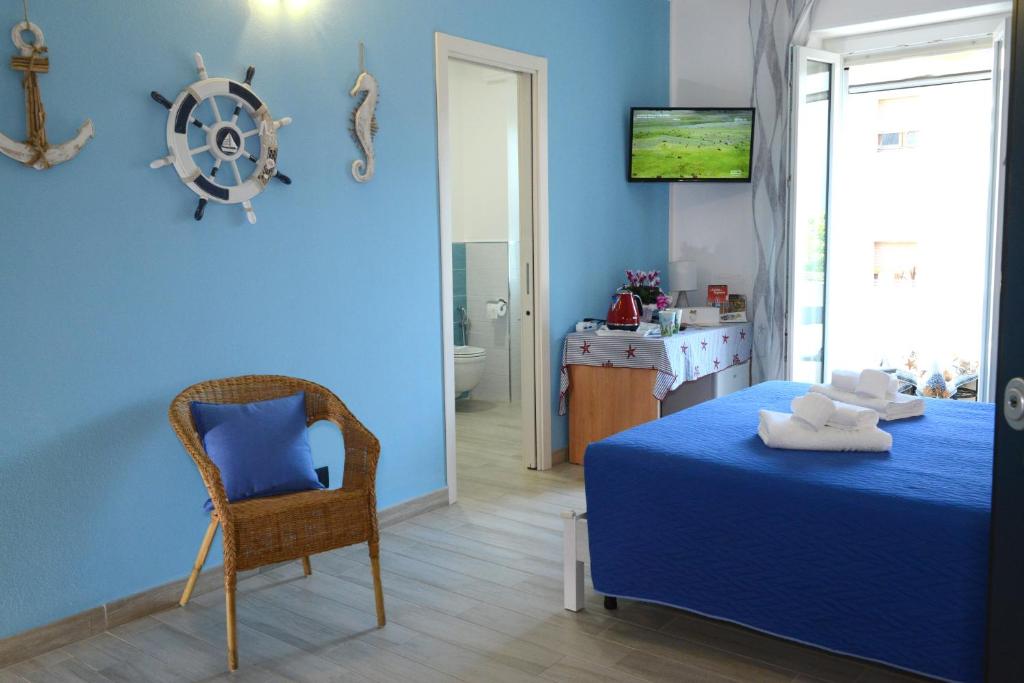 Łóżko lub łóżka w pokoju w obiekcie B&B LaMarina