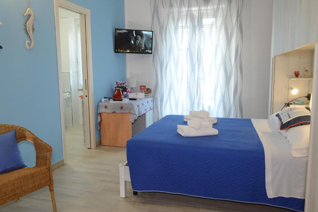 Łóżko lub łóżka w pokoju w obiekcie B&B LaMarina