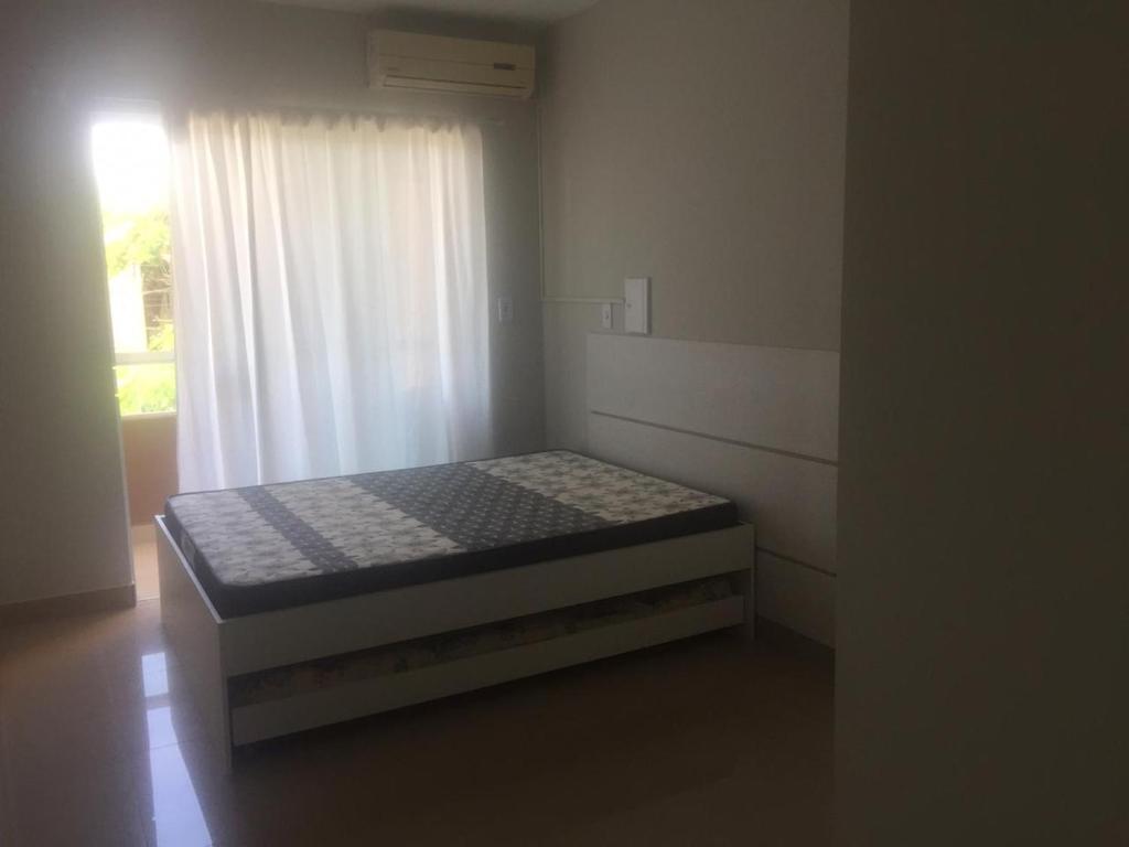 Tempat tidur dalam kamar di Casa Enseada/Prainha/Praia Grande