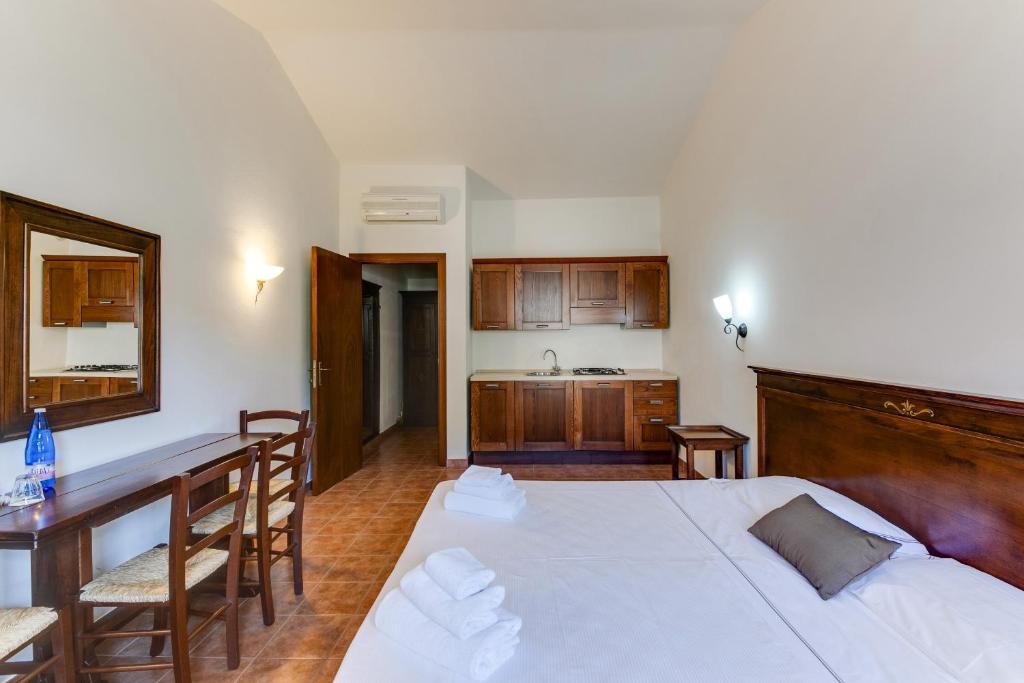 Posteľ alebo postele v izbe v ubytovaní Borgo Magliano Resort
