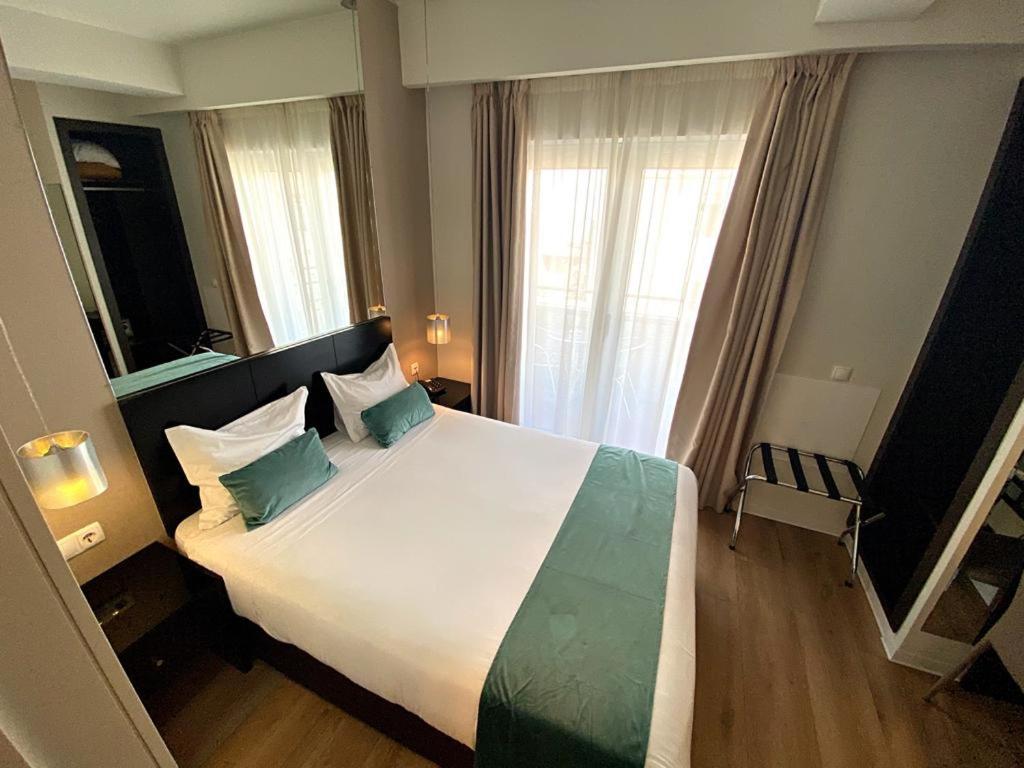 A bed or beds in a room at Lisbon City Hotel by City Hotels