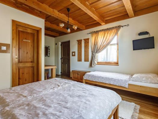 Postel nebo postele na pokoji v ubytování Tóth Vendégház és Apartmanház Újfehértó