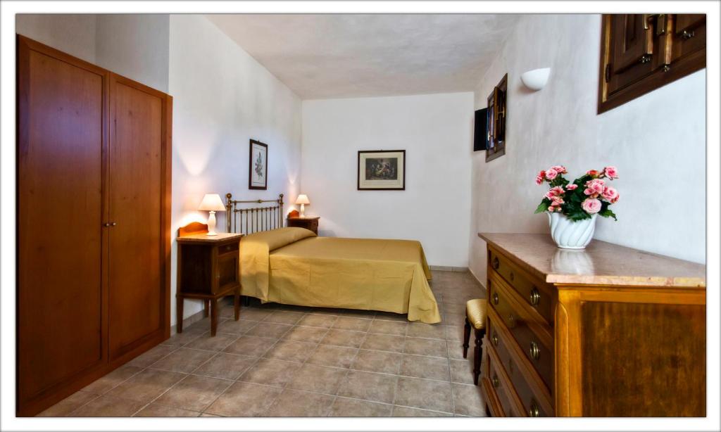 Postel nebo postele na pokoji v ubytování AGRITURISMO CASA VACANZE Antico Baglio