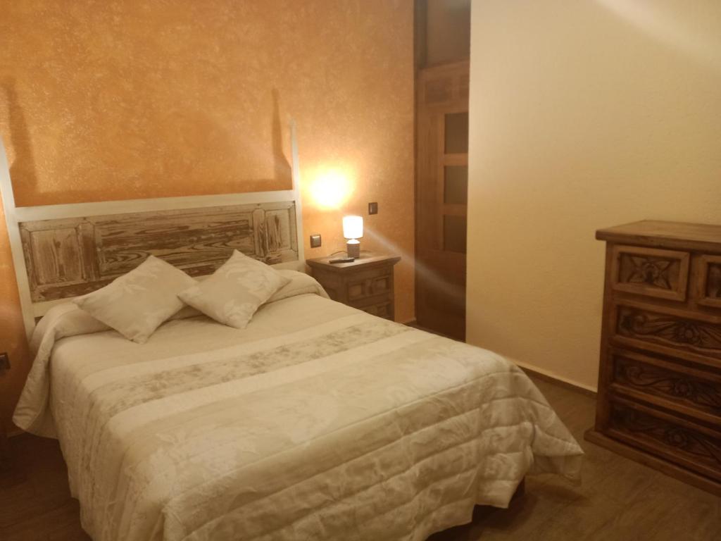 Postel nebo postele na pokoji v ubytování La Cerca