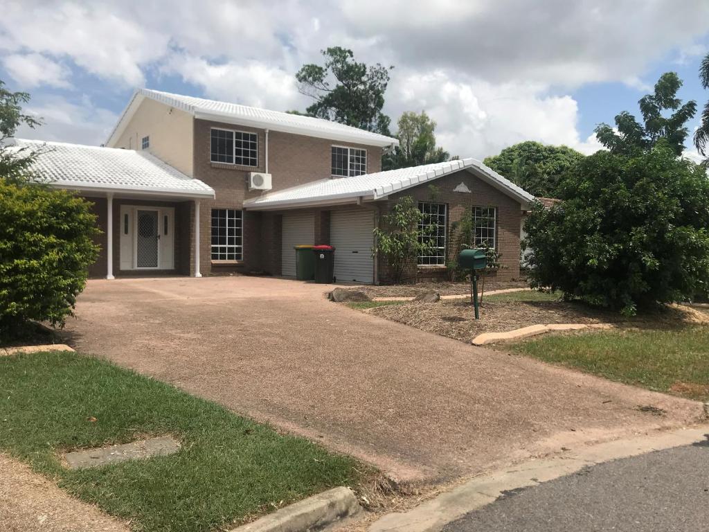 a house with a driveway in front of it at Townsville Wistaria Spacious Home in Townsville