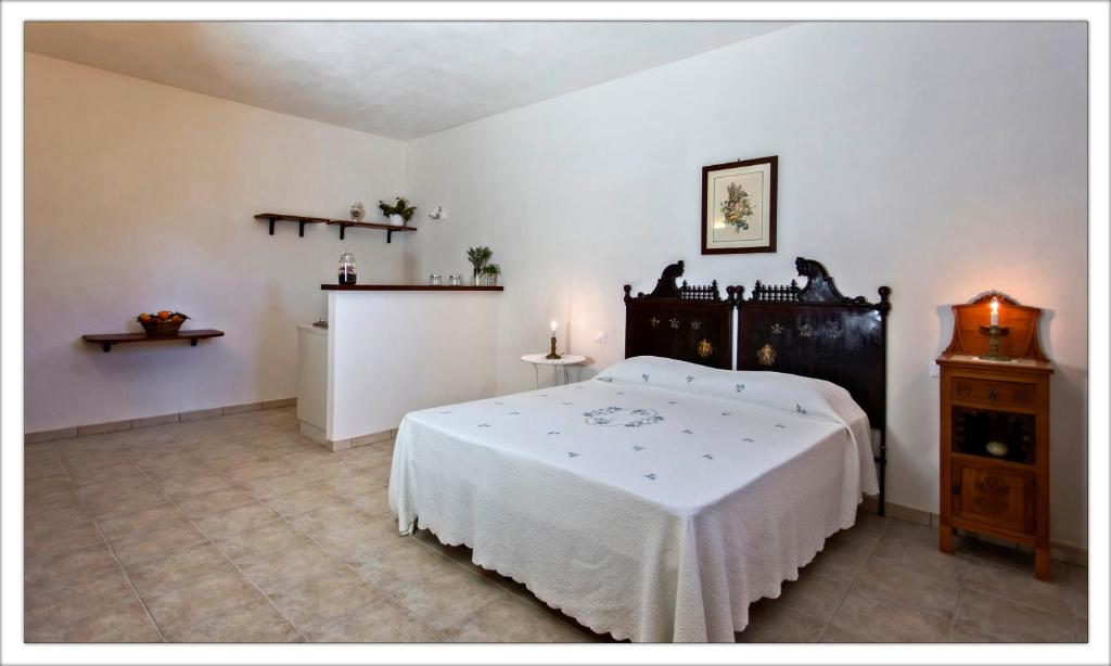 Postel nebo postele na pokoji v ubytování AGRITURISMO CASA VACANZE Antico Baglio
