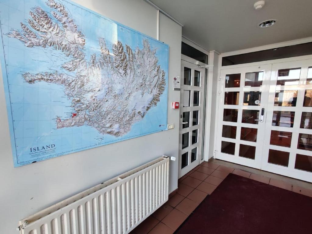 a large map on a wall in a room at SM Hostel in Reykjavík