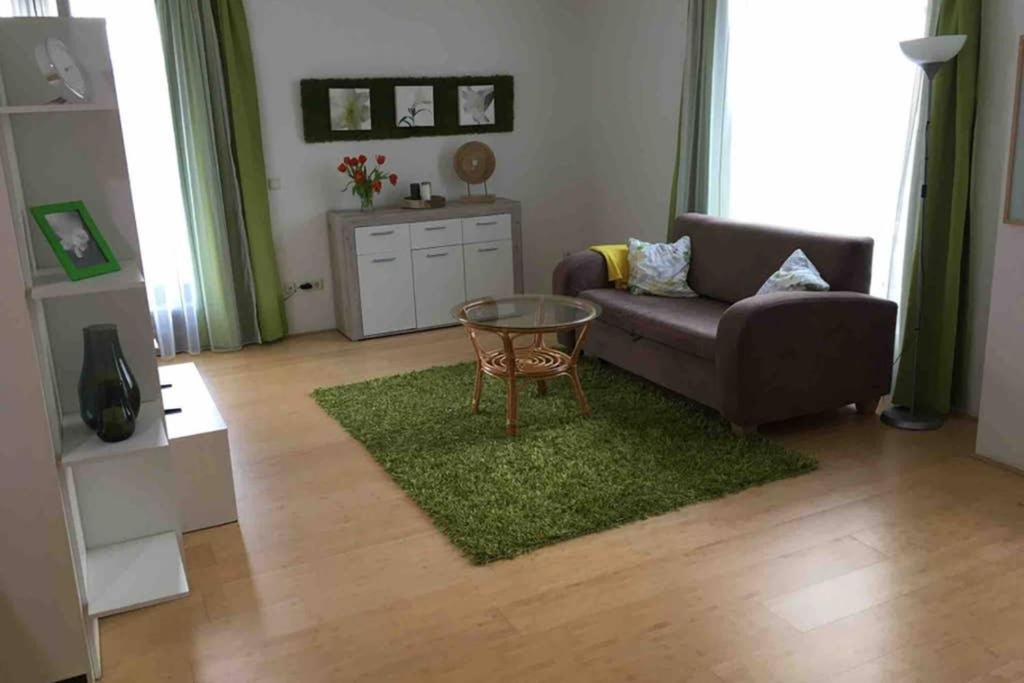 a living room with a couch and a table at Ferienwohnung Bitzenstraße in Haiger